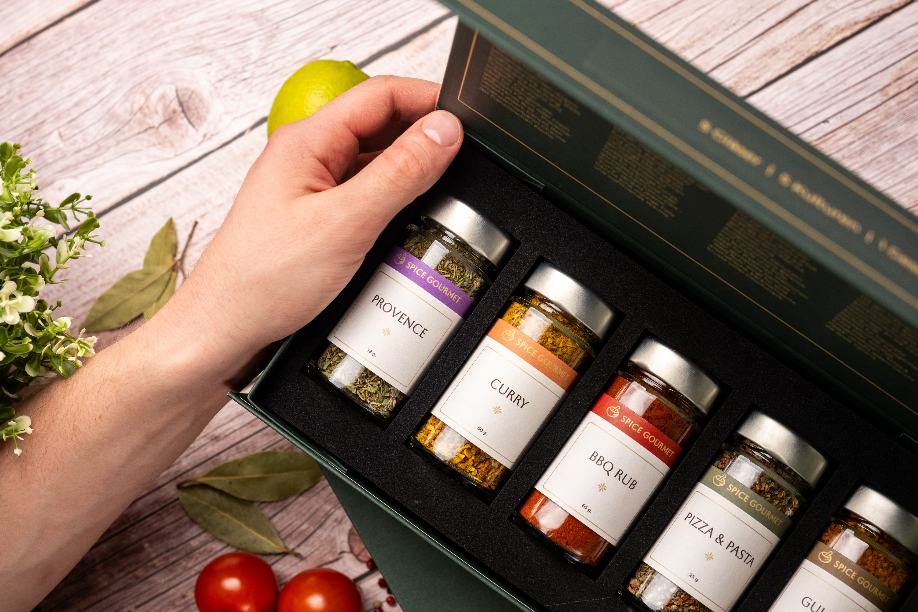 Premium spice gift set with gourmet seasoning jars labeled Provence, Curry, BBQ Rub, Pizza & Pasta, and Gourmet blend, presented in an elegant green box — perfect culinary gift for food lovers